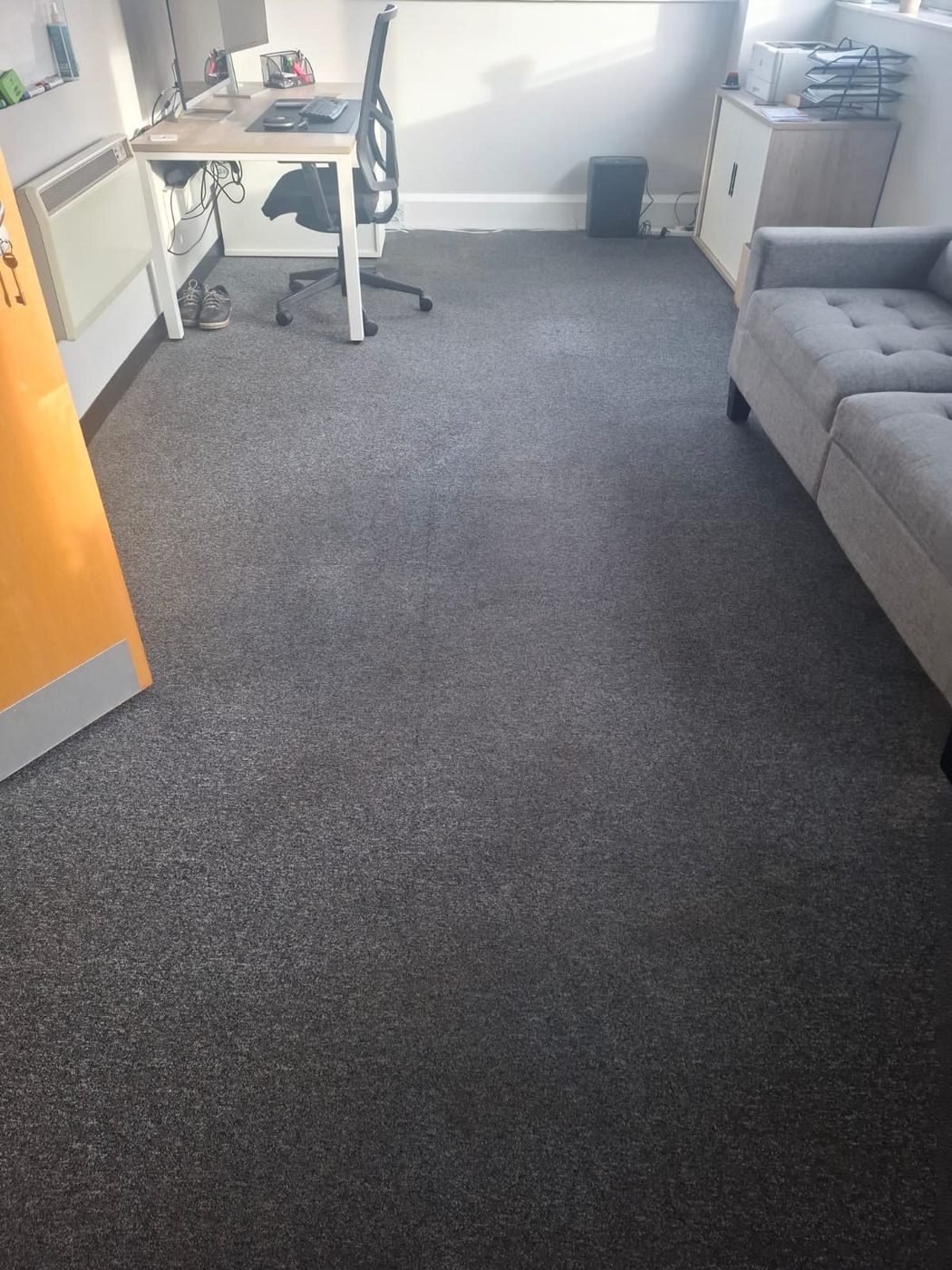 Wide office shot showing clean grey commercial carpet after Eastrada hot-water extraction