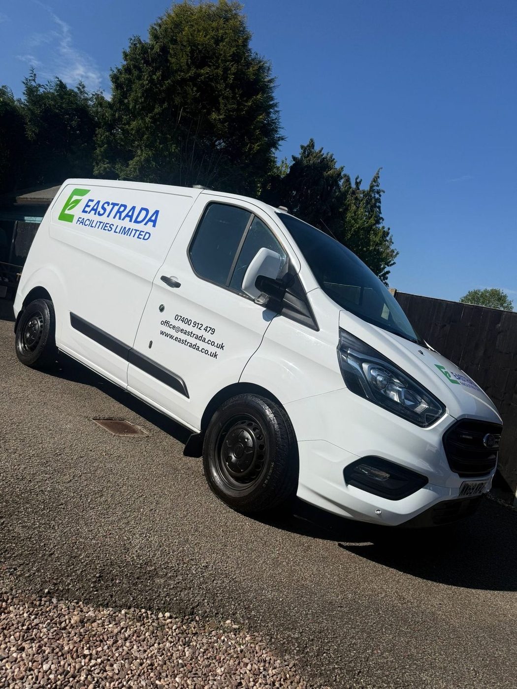Eastrada Facilities branded Ford Transit Custom van with full company livery, phone number and website on side